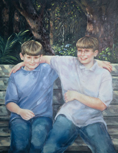two boys seated together on a seat